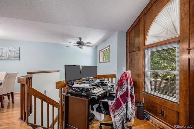 16724 E Hialeah Ave, Centennial, CO 80015 - home office with light wood finished floors, a textured ceiling, and a ceiling fan
