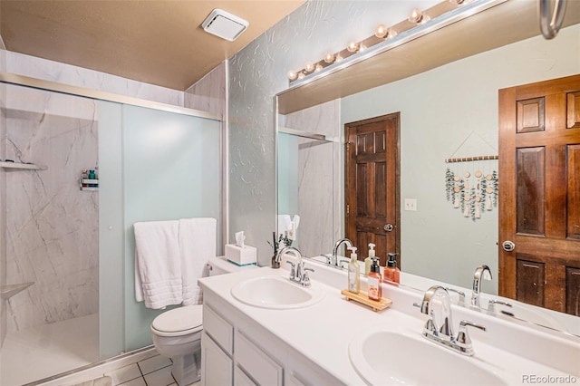 16724 E Hialeah Ave, Centennial, CO 80015 - full bathroom with a marble finish shower, double vanity, and tile patterned flooring