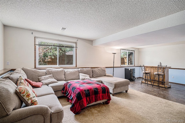 16724 E Hialeah Ave, Centennial, CO 80015 - living area featuring bar area and a textured ceiling