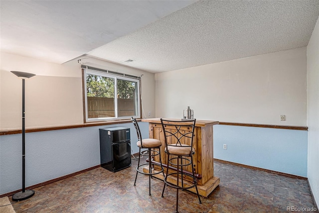 16724 E Hialeah Ave, Centennial, CO 80015 - indoor dry bar with baseboards and a textured ceiling