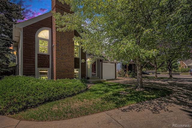 16724 E Hialeah Ave, Centennial, CO 80015 - view of front of property with driveway, a garage, and a chimney