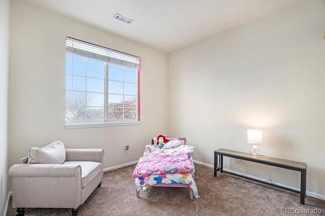 sitting room with carpet, baseboards, and visible vents