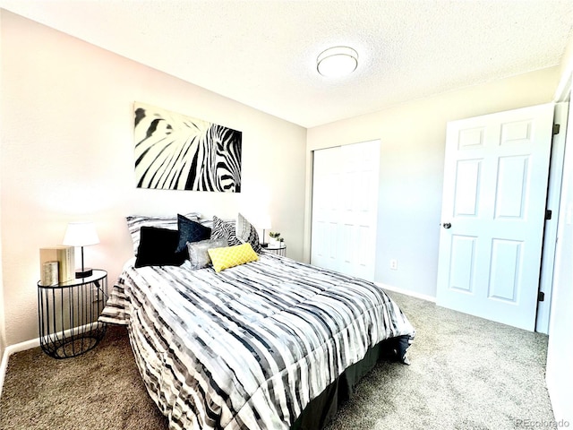 8820 Cody St, Broomfield, CO 80021 - carpeted bedroom featuring a closet, baseboards, and a textured ceiling