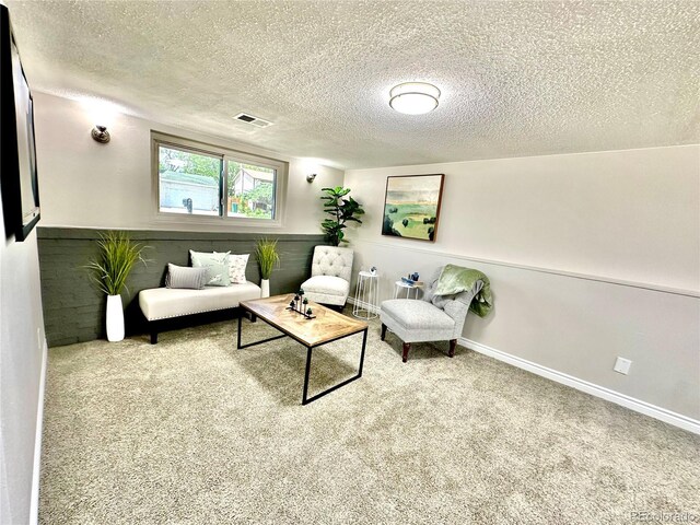 8820 Cody St, Broomfield, CO 80021 - carpeted living room featuring a textured ceiling