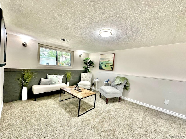 8820 Cody St, Broomfield, CO 80021 - living room featuring carpet, a textured ceiling, and baseboards