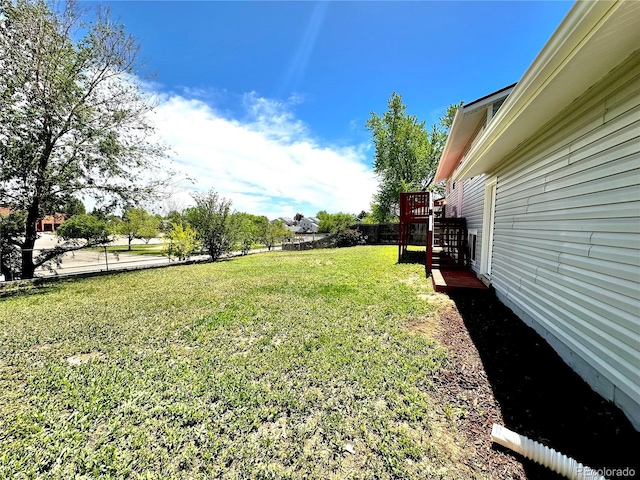 8820 Cody St, Broomfield, CO 80021 - view of grassy yard featuring stairs