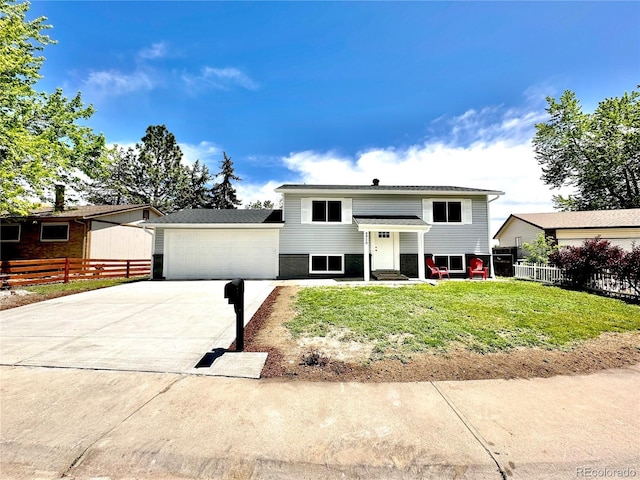 8820 Cody St, Broomfield, CO 80021 - bi-level home with concrete driveway and an attached garage