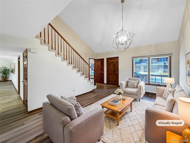 living room featuring a chandelier and light wood-type flooring