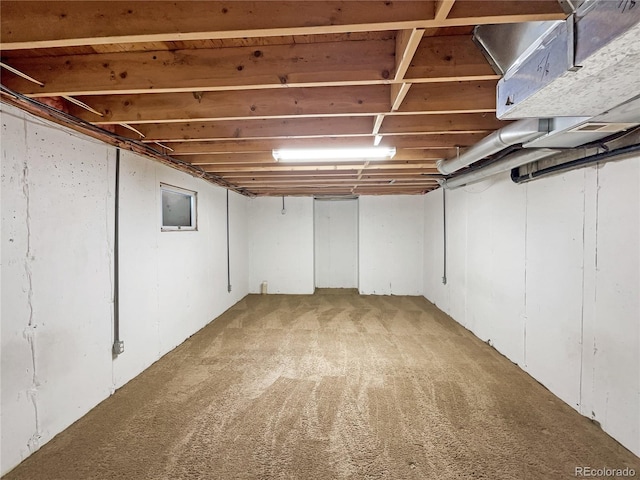 basement with carpet flooring