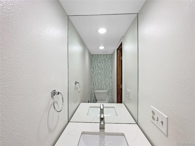 bathroom with vanity and toilet