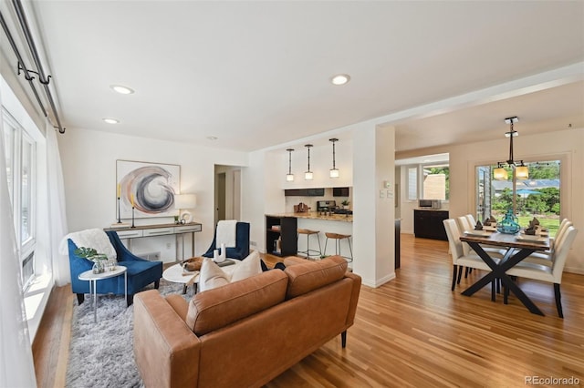 1370 S Hudson St, Denver, CO 80222 - living room featuring light wood finished floors, recessed lighting, and baseboards