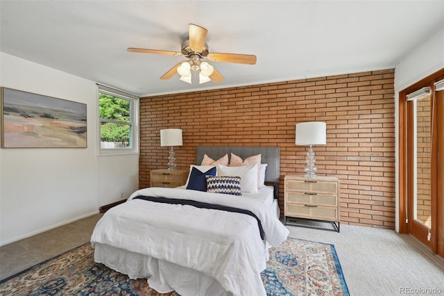 1370 S Hudson St, Denver, CO 80222 - carpeted bedroom featuring brick wall, baseboards, and ceiling fan