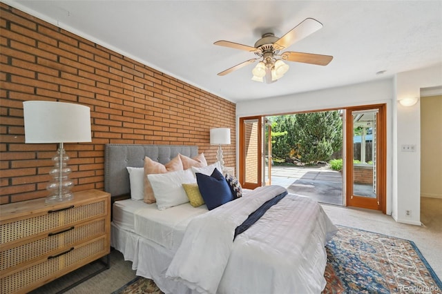 1370 S Hudson St, Denver, CO 80222 - carpeted bedroom with access to outside, brick wall, and baseboards