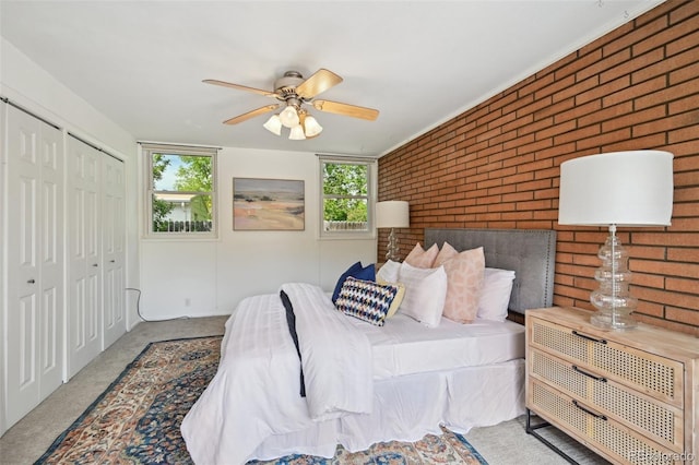 1370 S Hudson St, Denver, CO 80222 - bedroom featuring brick wall, a closet, a ceiling fan, and carpet floors