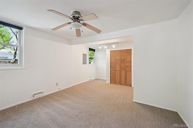 1370 S Hudson St, Denver, CO 80222 - empty room with rail lighting, electric panel, carpet floors, ceiling fan, and baseboards