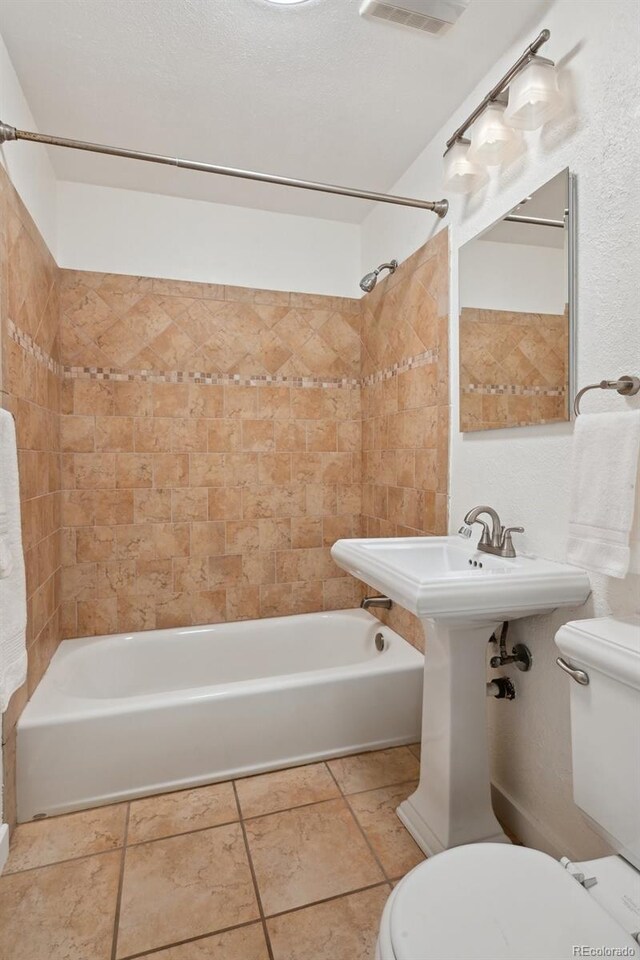 1370 S Hudson St, Denver, CO 80222 - full bathroom featuring toilet, shower / bathtub combination, and a sink