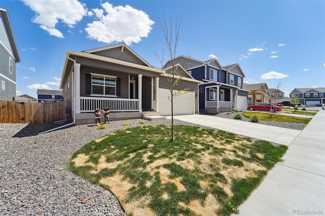 2226 Monte Vista St, Fort Lupton, CO 80621 - view of front facade featuring covered porch, driveway, a residential view, fence, and an attached garage