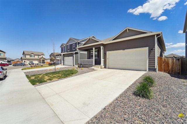 2226 Monte Vista St, Fort Lupton, CO 80621 - view of front facade featuring covered porch, driveway, a residential view, fence, and an attached garage