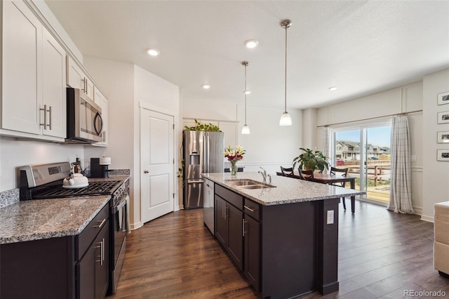 2226 Monte Vista St, Fort Lupton, CO 80621 - kitchen with a sink, dark wood finished floors, dark brown cabinetry, and stainless steel appliances