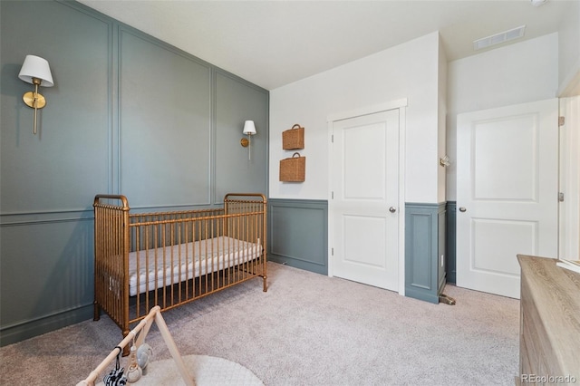 2226 Monte Vista St, Fort Lupton, CO 80621 - carpeted bedroom with a nursery area, a decorative wall, and visible vents
