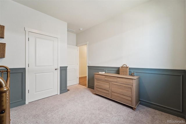 2226 Monte Vista St, Fort Lupton, CO 80621 - bedroom with light colored carpet, wainscoting, and visible vents