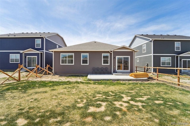 2226 Monte Vista St, Fort Lupton, CO 80621 - rear view of property featuring a lawn and a fenced backyard