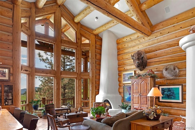 28267 Meadowlark Dr, Golden, CO 80401 - living room with high vaulted ceiling, beamed ceiling, and rustic walls