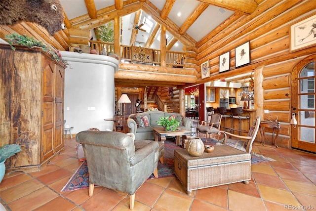 28267 Meadowlark Dr, Golden, CO 80401 - living room featuring high vaulted ceiling, log walls, beamed ceiling, tile patterned floors, and stairway