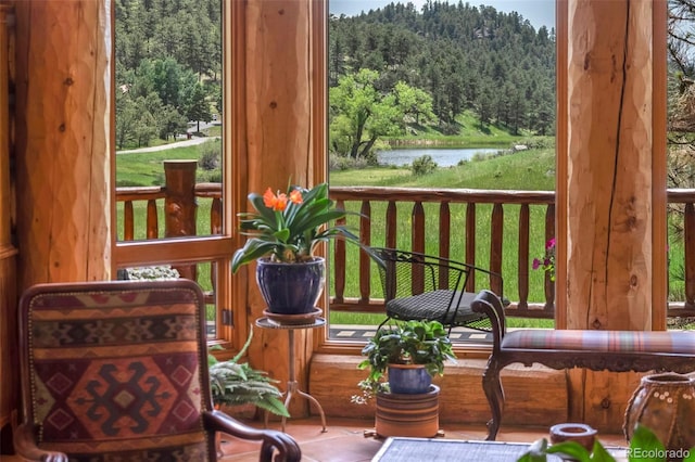28267 Meadowlark Dr, Golden, CO 80401 - sunroom with a wooded view and a water view