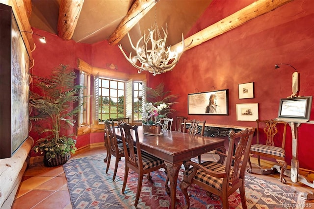 28267 Meadowlark Dr, Golden, CO 80401 - dining area featuring a chandelier, beam ceiling, tile patterned floors, and high vaulted ceiling