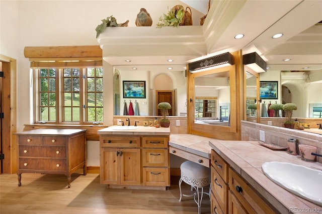 28267 Meadowlark Dr, Golden, CO 80401 - full bath with wood finished floors, two vanities, and recessed lighting