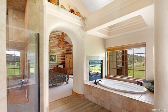 28267 Meadowlark Dr, Golden, CO 80401 - full bathroom featuring wood finished floors, a garden tub, rustic walls, and ensuite bathroom