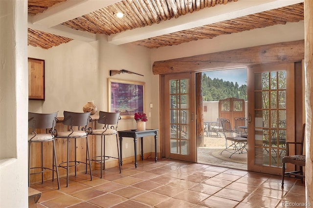 28267 Meadowlark Dr, Golden, CO 80401 - doorway to outside featuring french doors, tile patterned floors, and a wood ceiling with exposed beams