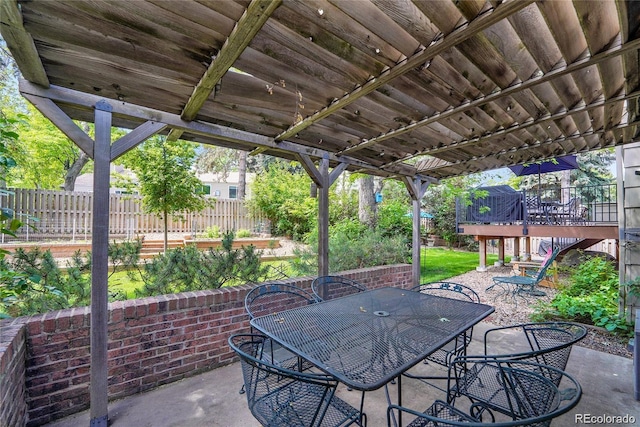 5050 W 102nd Ave, Westminster, CO 80031 - view of patio featuring outdoor dining space and a wooden deck
