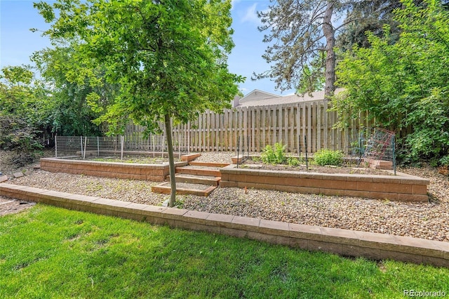 5050 W 102nd Ave, Westminster, CO 80031 - view of yard featuring a vegetable garden