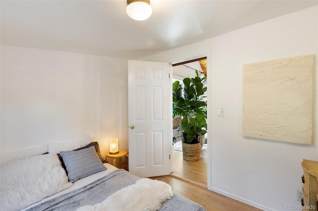 426 Corona Ave, Palmer Lake, CO 80133 - bedroom featuring light wood-style flooring and baseboards