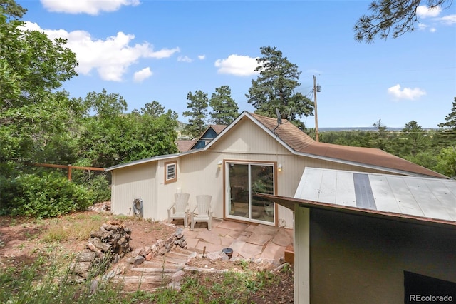 426 Corona Ave, Palmer Lake, CO 80133 - rear view of house featuring a patio
