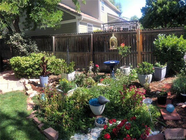 view of yard featuring a vegetable garden and fence