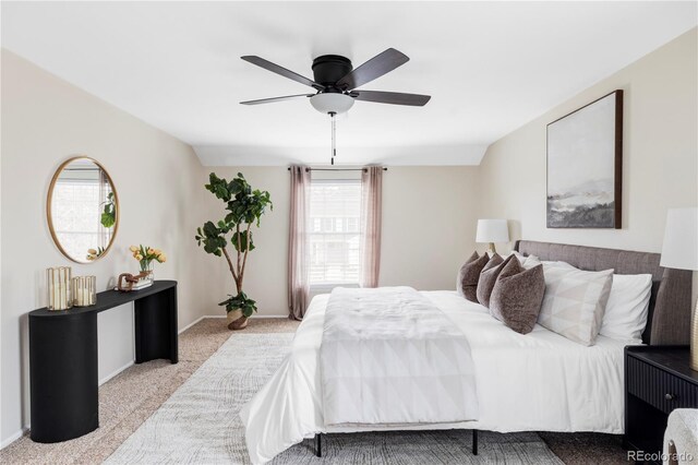 bedroom with carpet flooring, baseboards, and a ceiling fan