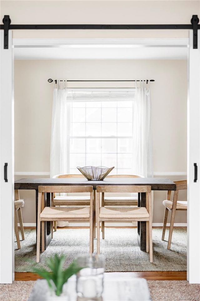 dining area with a barn door