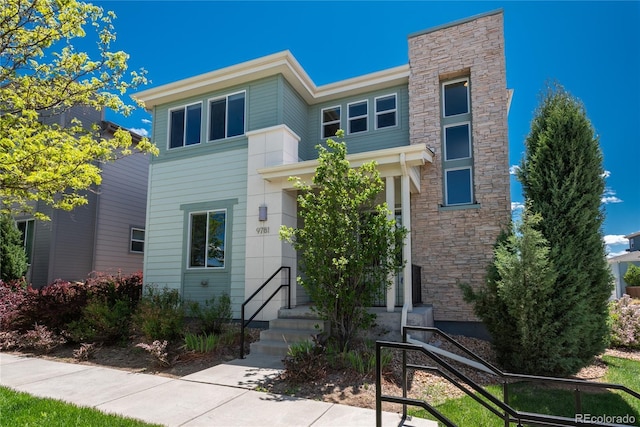 9781 Dunning Cir, Highlands Ranch, CO 80129 - view of front facade featuring stone siding