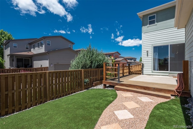 9781 Dunning Cir, Highlands Ranch, CO 80129 - fenced backyard with a wooden deck
