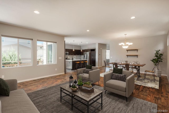 9781 Dunning Cir, Highlands Ranch, CO 80129 - living room with dark wood-style floors, a chandelier, and recessed lighting