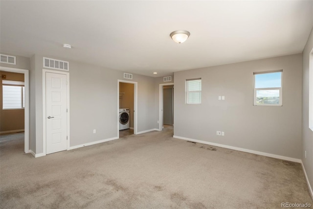 9781 Dunning Cir, Highlands Ranch, CO 80129 - empty room with washer / clothes dryer, carpet, and a smoke detector