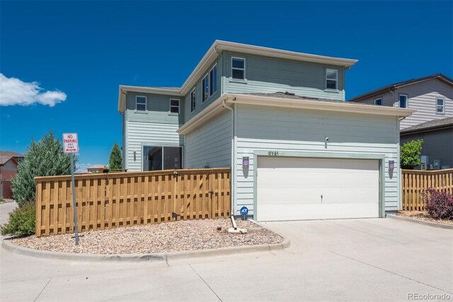9781 Dunning Cir, Highlands Ranch, CO 80129 - traditional-style house featuring a garage and driveway
