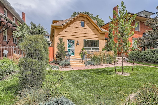 view of front of home with a front yard