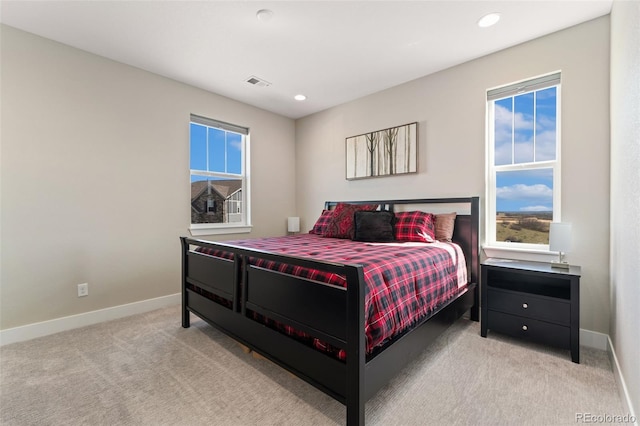 bedroom with carpet flooring, recessed lighting, baseboards, and visible vents