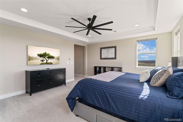 bedroom featuring light colored carpet, recessed lighting, a raised ceiling, and baseboards