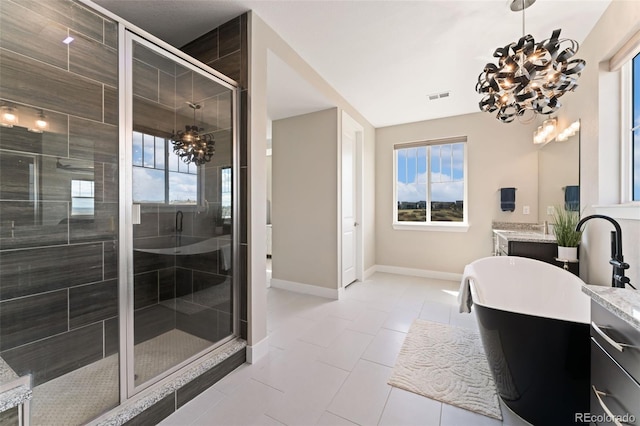 full bath featuring vanity, a chandelier, baseboards, visible vents, and a stall shower