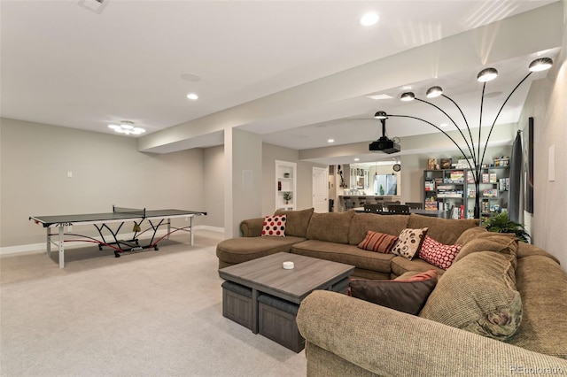 living room featuring light colored carpet, recessed lighting, and baseboards